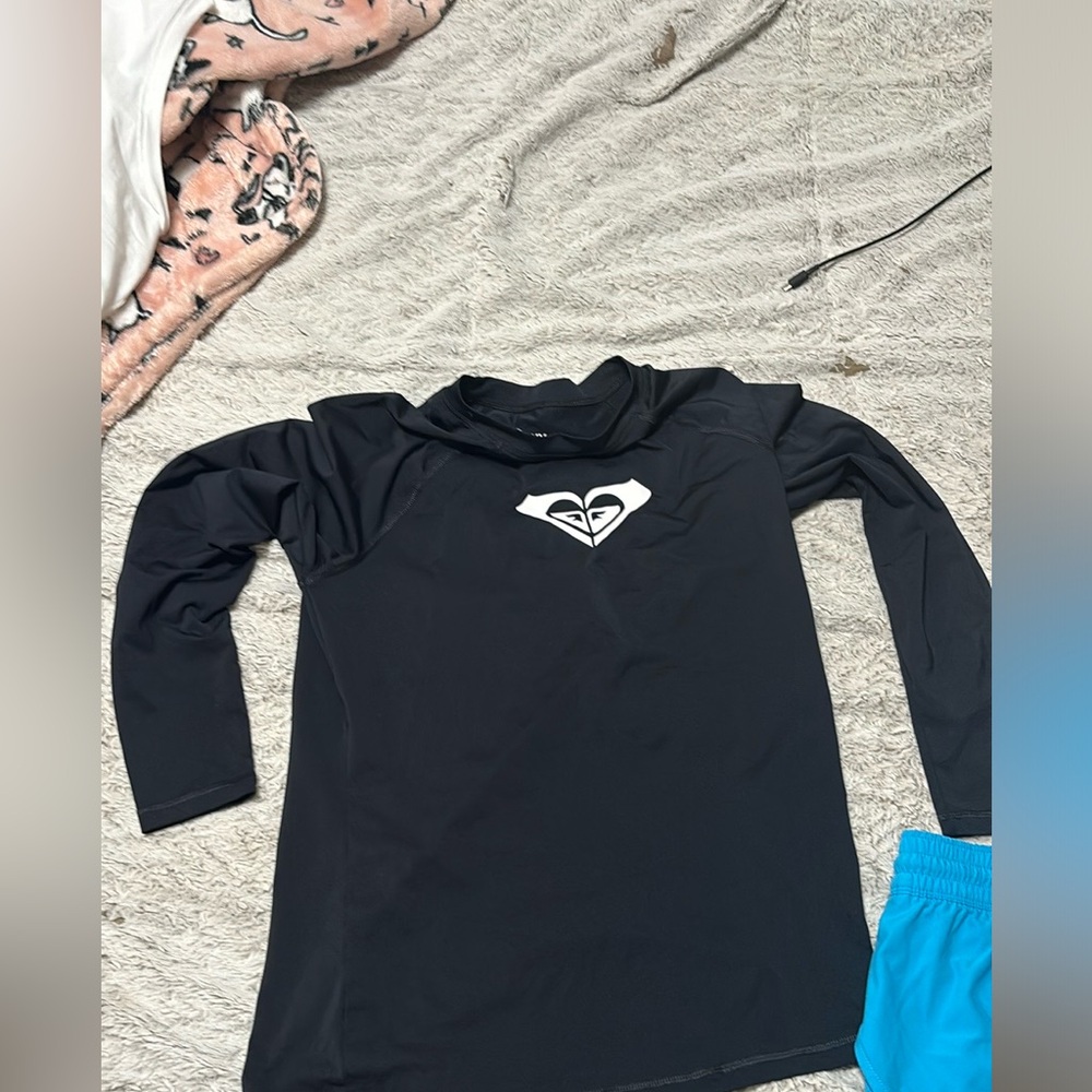 Swim shorts and rash guard.